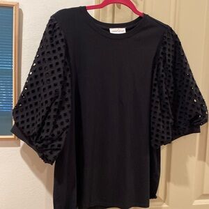 This is a XL black puffy lattice work sleeve top. Very elegant.